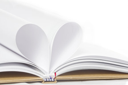 pages of a book curved into a heart shape 