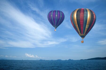 colorful hot air balloon in blue sky, with sky ideal as copy space の写真素材