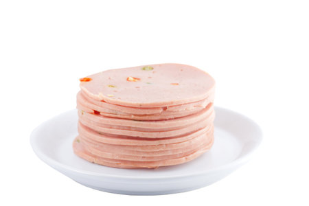 slices of ham isolated on the white background の写真素材