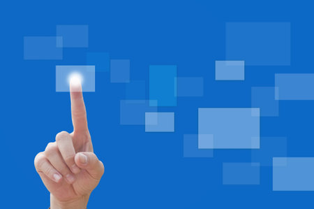 hand pushing a button on a touch screen interface 