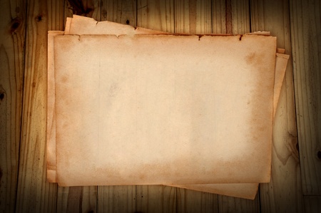 Old brown paper on wood panelの写真素材