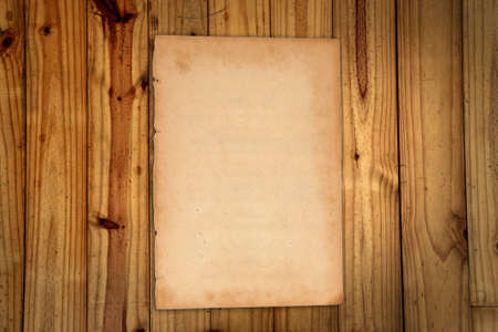 Empty white Crumpled paper on wood table vertical の写真素材