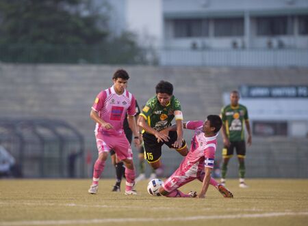 BANGKOK THAILAND- MAR19: Thai Premier League (TPL) between Army Utd. (green) vs Sisaket Mungthail Fc (pring) on March 19, 2011 at Army Stadium in Bangkok Thailand のeditorial素材