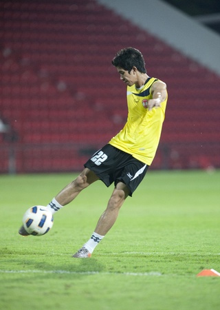 THAILAND- APRIL 12 : the AFC CUP Group G between Muang Thong UTD (Red) vs Victory SC (white) on April 12, 2011 at Thunderdome Stadium in Nonthaburi, Thailand のeditorial素材