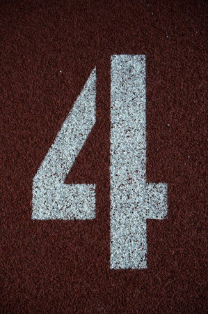 Number 4 on the start of a running track - check my portfolio for other numbers 