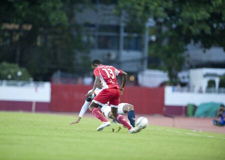 BANGKOK THAILAND- AUGUST 3 : Toyota League Cup  between BEC Tero Fc (Red) vs Supunburi Fc (White) on August 3 , 2011 at thebhussadin Stadium Bangkok, Thailandのeditorial素材
