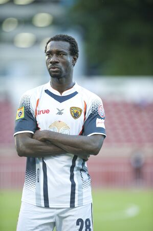 BANGKOK THAILAND- AUGUST 3 : Toyota League Cup  between BEC Tero Fc (Red) vs Supunburi Fc (White) on August 3 , 2011 at thebhussadin Stadium Bangkok, Thailandのeditorial素材