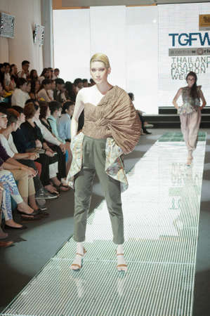 BANGKOK, THAILAND - SEPTEMBER 16 : Model showcases on the catwalk during Thailand Graduate Fashion Week 2011 ( TGFW ) on September 16, 2011 in Bangkok Thailand. のeditorial素材