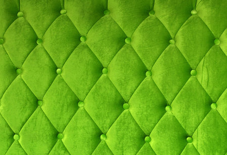Green button-tufted leather background の写真素材