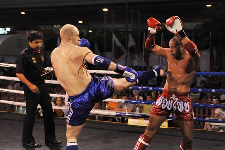 BANGKOK, THAILAND- MARCH 22 : Unidentified athletes compete in World Amateur Muaythai Champioships 2012. on March 22, 2012 at National Stadium, Bangkok, Thailand のeditorial素材