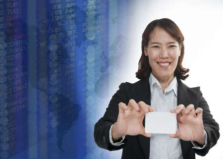 Businesswoman with exchange graphics on the backgroundの写真素材