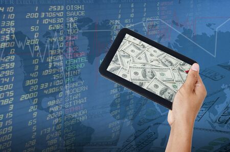 hand businesswoman with exchange graphics on the backgroundの写真素材
