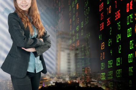 Portrait of smiling business woman   over stock exchange background 