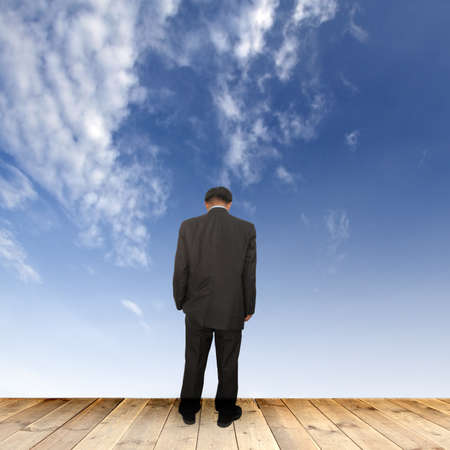 Businessman walking on a wooden floor の写真素材