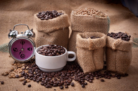 A cup of cafe latte and coffee beans の写真素材