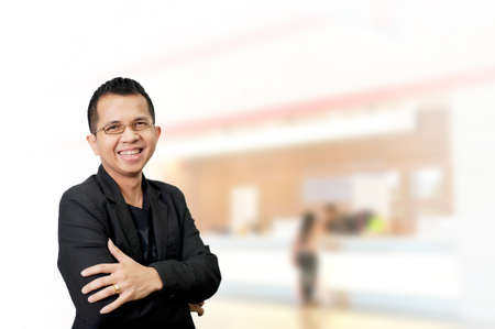 Portrait of young asia businessman in officeの写真素材