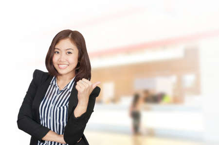 Portrait of young asia business woman in her office.Mixed Asian / Caucasian businesswoman.の写真素材