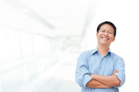 Portrait of young asia businessman in officeの写真素材