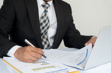 Businesswoman examine finance, tax, accounting, statistics and analytic research concept