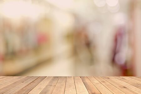 Wood table top with blurred office as background - can be used for montage or display your productsの写真素材