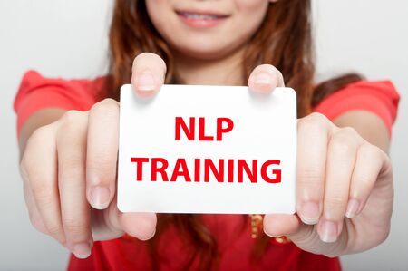 Businesswoman showing card with nlp training message,の写真素材
