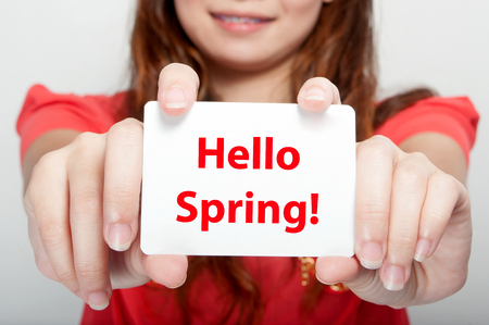 Businesswoman showing card with hello spring message,の写真素材