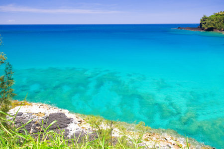 Cliff overlooking a reef in the Pacific Ocean.の写真素材