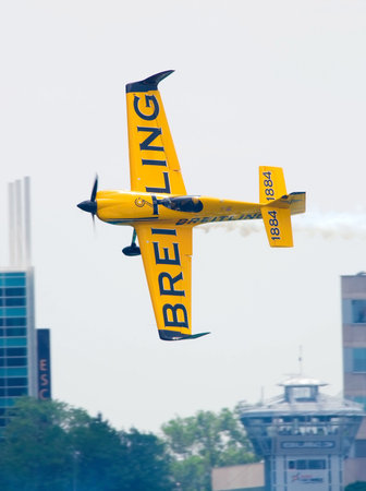 WINDSOR, ONT JUNE 4 - Airplane races by the control tower at the  International Red Bull Air Races...
