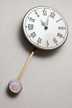  Round clock with the Roman figures and a pendulumの写真素材