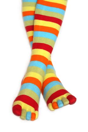 Legs in striped stockings on a white backgroundの写真素材