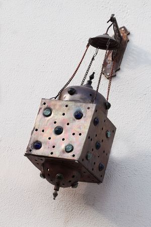 The lantern hanging on a wallの写真素材