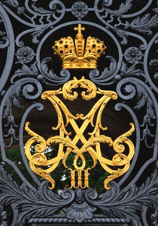 Fencing with an imperial monogram close upの写真素材