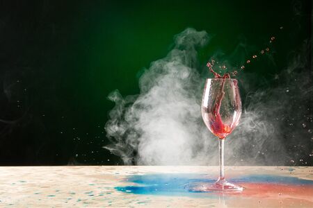Wine Glass Splatter with Smokeの写真素材