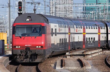 Zurich Switzerland  3 June 2015: passenger train arriving to the Zurich main railway station German: Zurich Hauptbahnhof. Zurich is the largest city in Switzerland and the capital of the Canton of Zurich.のeditorial素材