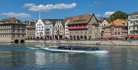 Zurich, Switzerland - 30 July, 2015: view on the Limmat river and the Limmatquai quay with the "Regula" ship passing. Zurich is the largest city in Switzerland, it is also the capital of the Canton of Zurich.のeditorial素材