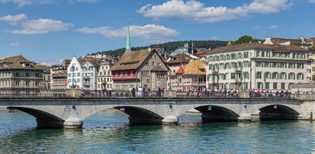 Zurich, Switzerland - 30 July, 2015: the Muensterbruecke bridge over the Limmat river. Zurich is the largest city in Switzerland, it is also the capital of the Canton of Zurich.のeditorial素材