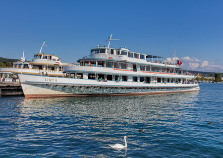 Zurich, Switzerland - 21 August, 2015: "Linth" ship at pier on the Lake Zurich at the Burkliplatz square. Zurich is the largest city in Switzerland and the capital of the Canton of Zurich.のeditorial素材