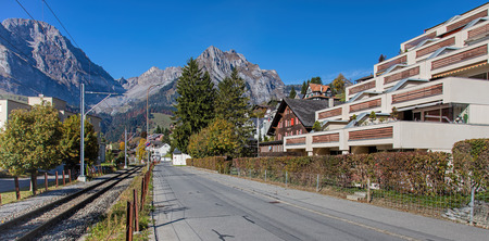 Engelberg, Switzerland - 12 October, 2015: view along the Dorfstrasse street with mountains in the background. Engelberg is a resort town and municipality in the canton of Obwalden.のeditorial素材