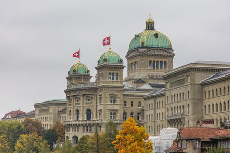 Bern, Switzerland - 19 October 2015: the Federal Palace of Switzerland building decorated with flags...
