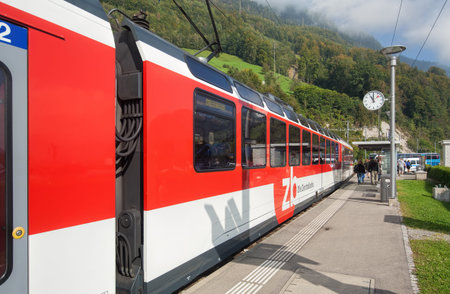 Alpnachstad, Switzerland - 23 September, 2014: a Zentralbahn train passing the Alpnachstad railway station. Zentralbahn is a Swiss railway company that owns and operates two connecting railway lines in Central Switzerland and the Bernese Oberland. It was のeditorial素材
