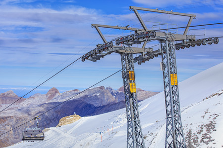 Mt. Titlis, Switzerland - 12 October, 2015: the "Ice Flyer" ski lift, view from the station on the top of the mountain. Titlis is a mountain of the Uri Alps, located on the border between the cantons of Obwalden and Berne. At 3,238 metres above sea level,のeditorial素材