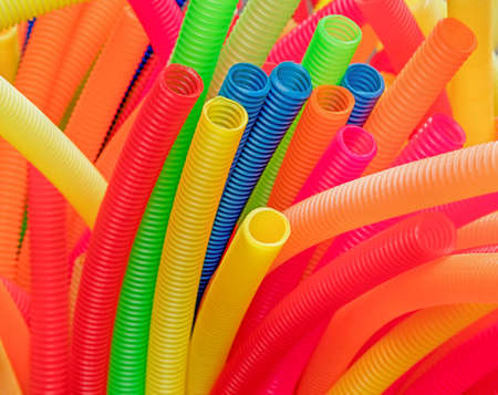 Colorful corrugated plastic pipes: red,yellow, blue.の写真素材