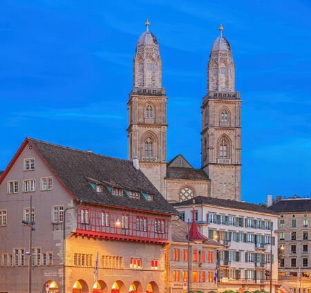 Zurich, Switzerland - 16 August, 2013: Grossmunster cathedral and the Limmatquai quay in the evening. The Grossmunster "Great Minster" is a Romanesque-style Protestant church in Zurich, Switzerland, it is one of the four major churches in the city.のeditorial素材