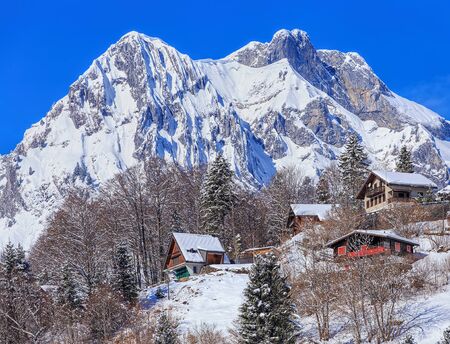 Engelberg, Switzerland - 9 March 2016: view with residential houses in the foreground and mountains in the background. Engelberg is a resort town and municipality in the Swiss canton of Obwalden.のeditorial素材
