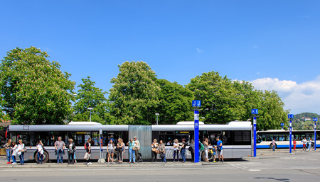 Lucerne, Switzerland - 7 May, 2016: people and buses on the bus stop on Bahnhofplatz square. Lucerne is a city in central Switzerland, it is the capital of the Swiss Canton of Lucerne and the capital of the district of the same name.のeditorial素材