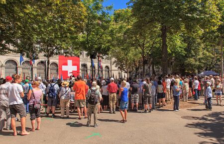 Zurich, Switzerland - 1 August, 2013: people on Burkliplatz square listening to the speech devoted to the Swiss National Day. The Swiss National Day (German: Schweizer Bundesfeier) is the national holiday of Switzerland, celebrated on the 1st August.のeditorial素材