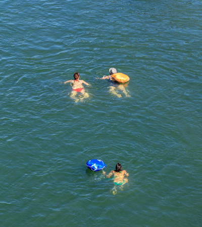 Basel, Switzerland - 27 August, 2016: people swimming in the Rhine river, view from the Johanniterbruecke bridge. Basel is a city on the Rhine river in northwestern Switzerland, situated where the Swiss, German and French borders meet.のeditorial素材
