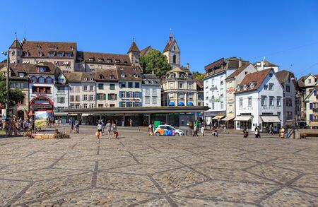 Basel, Switzerland - 27 August, 2016: buildings and people on Barfuesserplatz square. Basel is a city on the Rhine river in northwestern Switzerland, situated where the Swiss, German and French borders meet.のeditorial素材