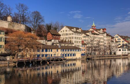 Zurich, Switzerland - 12 February, 2011: historic buildings along the Limmat river. Zurich is the larges city in Switzerland and the capital of the Swiss Canton of Zurich.のeditorial素材