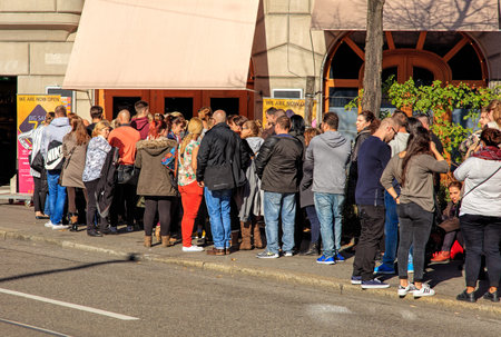 Zurich, Switzerland - 6 November, 2015: people waiting in a queue for a sale to begin. Zurich is the...